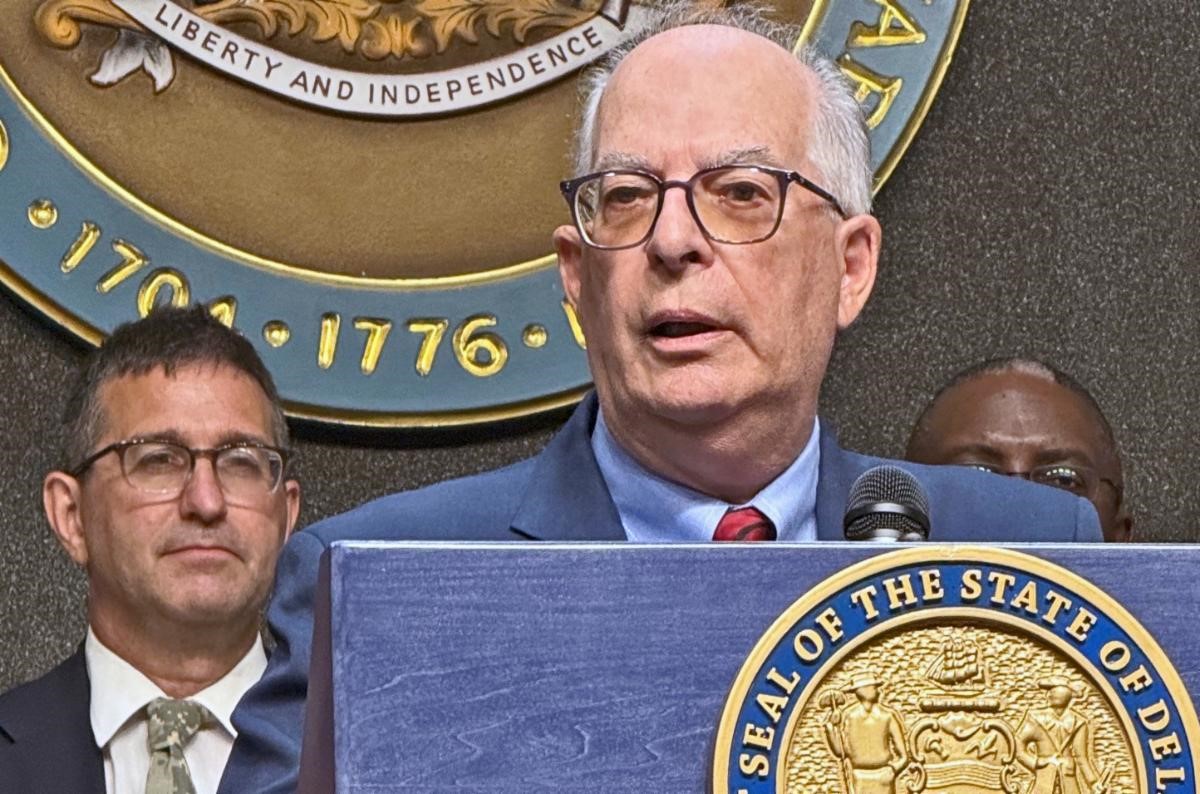 Rep. Short at podium with Gov. Meyer in background