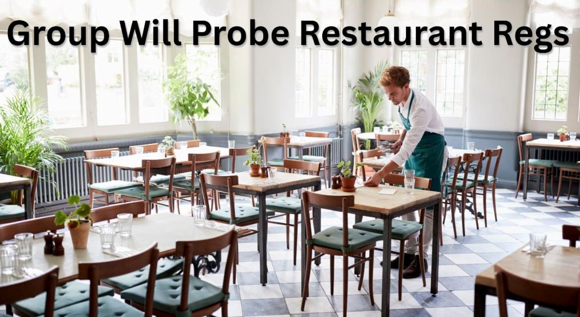 picture of inside a small restaurant with tables and waiter