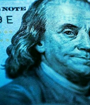 close up picture of Benjamin Franklin on the hundred dollar bill