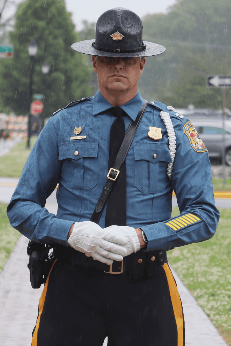 A Delaware State Trooper standing in the rain during the 53rd Annual Law Enforcement Memorial.